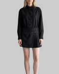 Model wearing the Celeste black belted shirt mini dress with long sleeves, button-front detailing, and a pleated mini skirt.