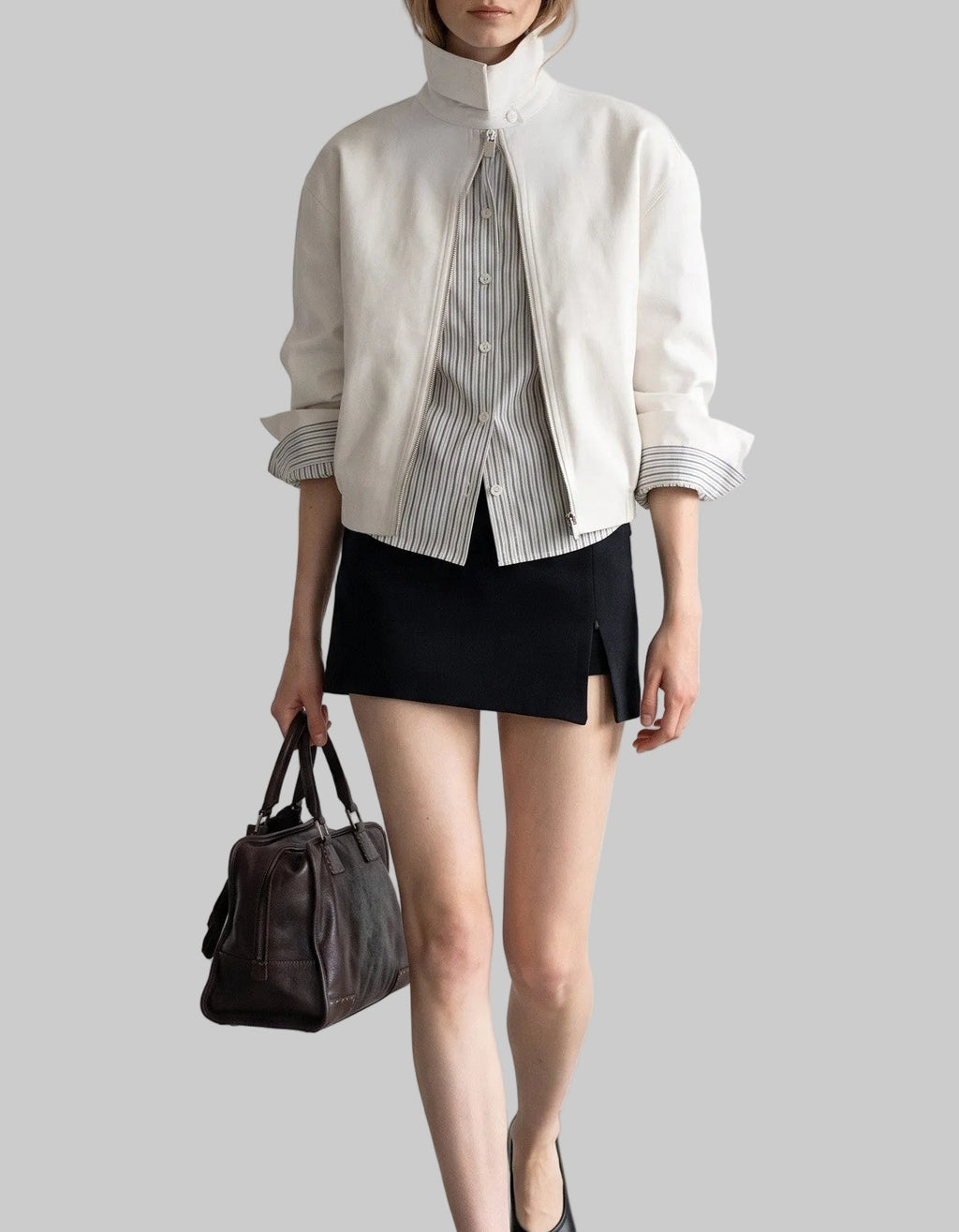 Sloane white layered jacket with zip-front closure and striped contrast cuffs