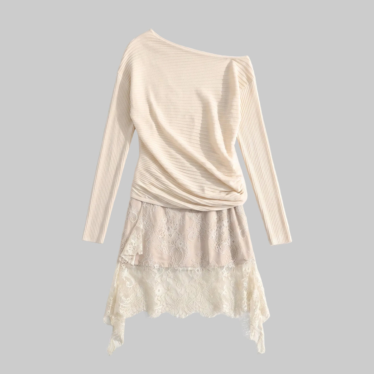 Model wearing the Celeste ivory two-piece set with an off-shoulder knit top and asymmetric lace mini skirt