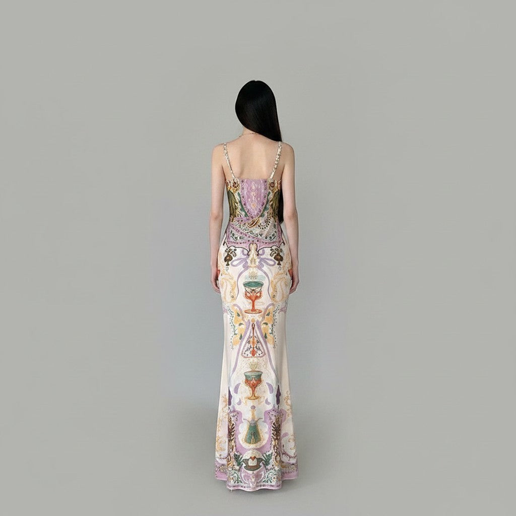 LUNRIA Baroque Chalice Print Satin Slip Maxi Dress with spaghetti straps and a square neck. Features a vintage chalice and heart motif.