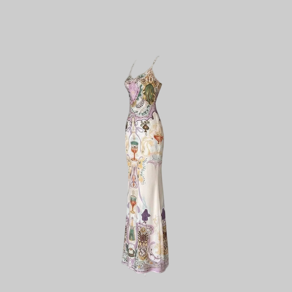 LUNRIA Baroque Chalice Print Satin Slip Maxi Dress with spaghetti straps and a column silhouette.