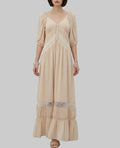 LUNRIA beige maxi dress featuring a V-neckline, soft puff sleeves, delicate lace trim, gathered detailing, and a flowing tiered maxi skirt.