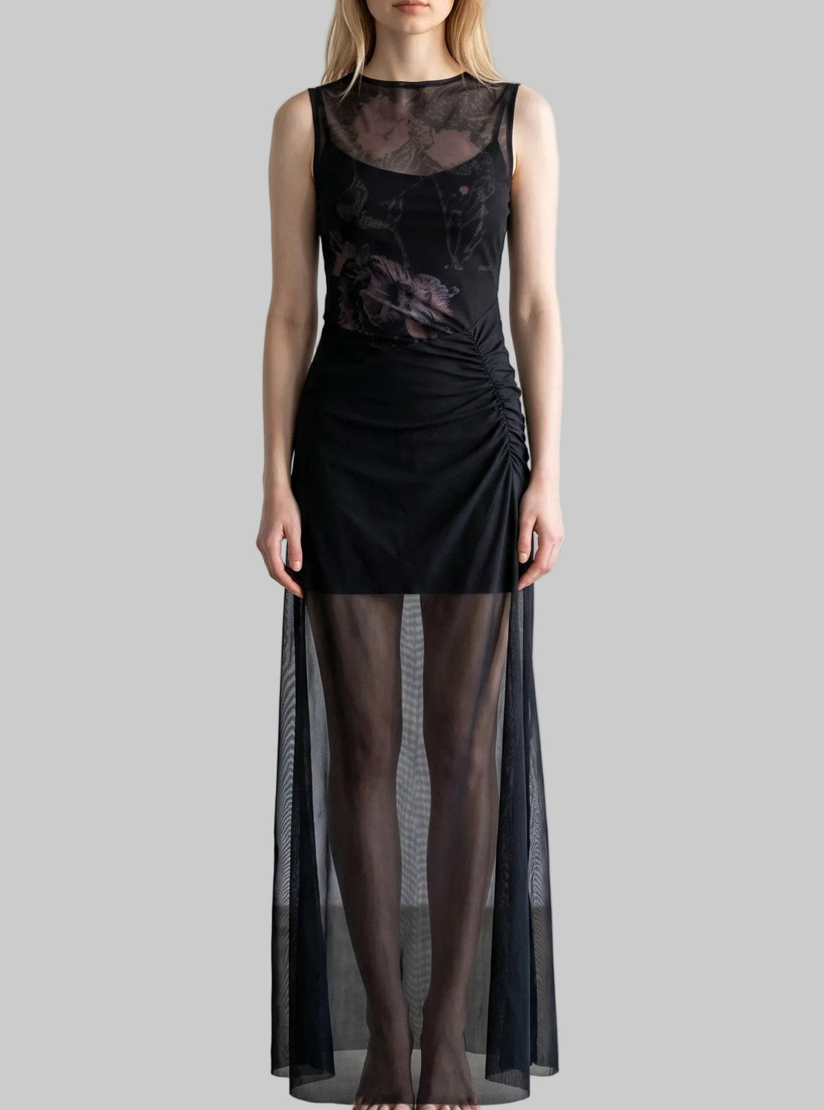 LUNRIA black floral mesh maxi dress featuring a sheer overlay, ruched waist detailing, sleeveless silhouette, and floor-length design.