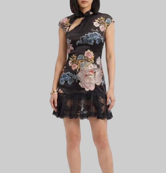 LUNRIA black floral mini dress featuring a qipao-inspired high neckline, asymmetric chest cutout, fitted silhouette, lace ruffle hem, and lace-up back.