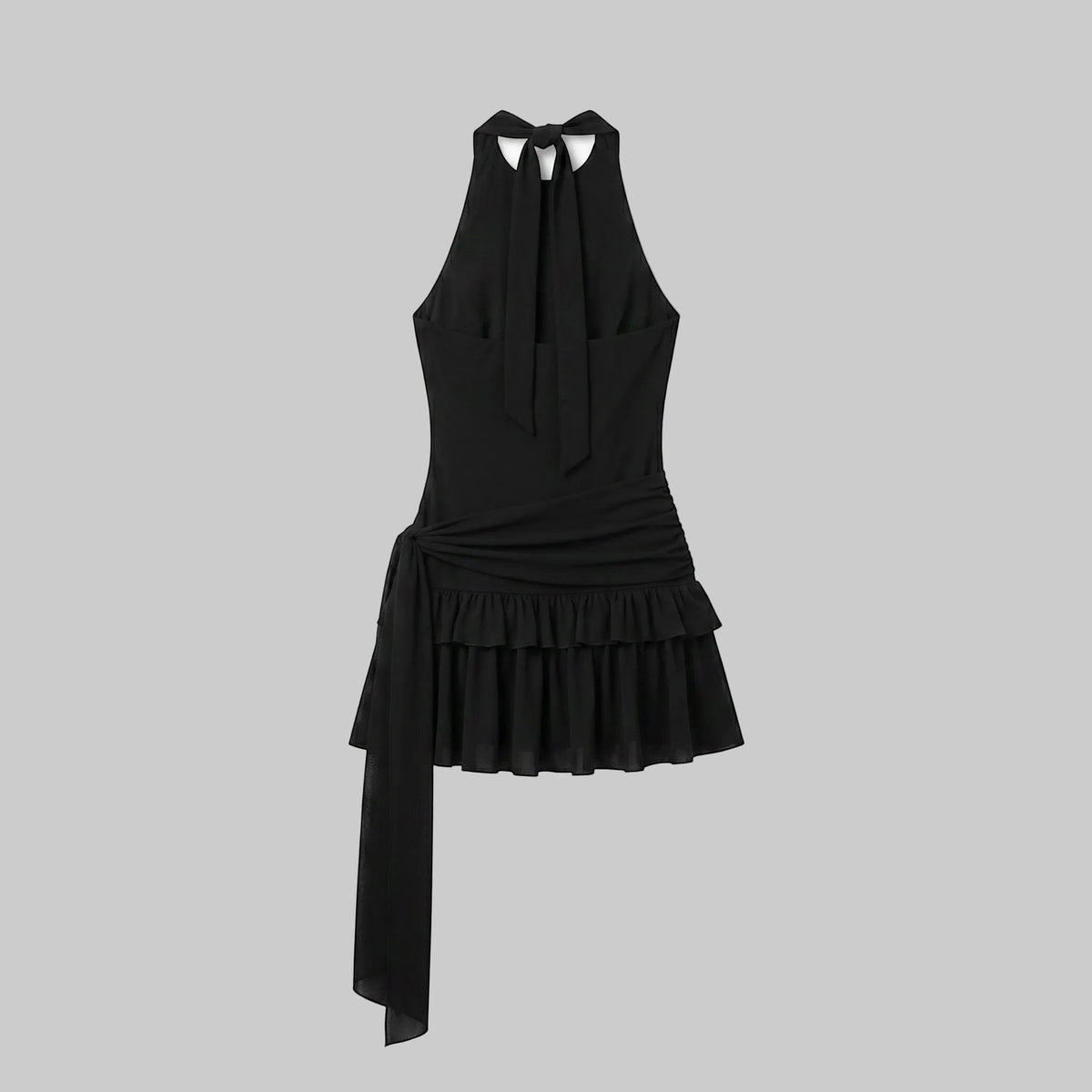 Black halter mini dress with ruched waist, sequin cross detail, ruffle hem, and asymmetric draped side panel.