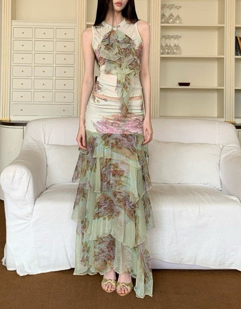 LUNRIA floral tiered maxi skirt featuring a soft pastel print, layered chiffon ruffles, and a flowy silhouette.