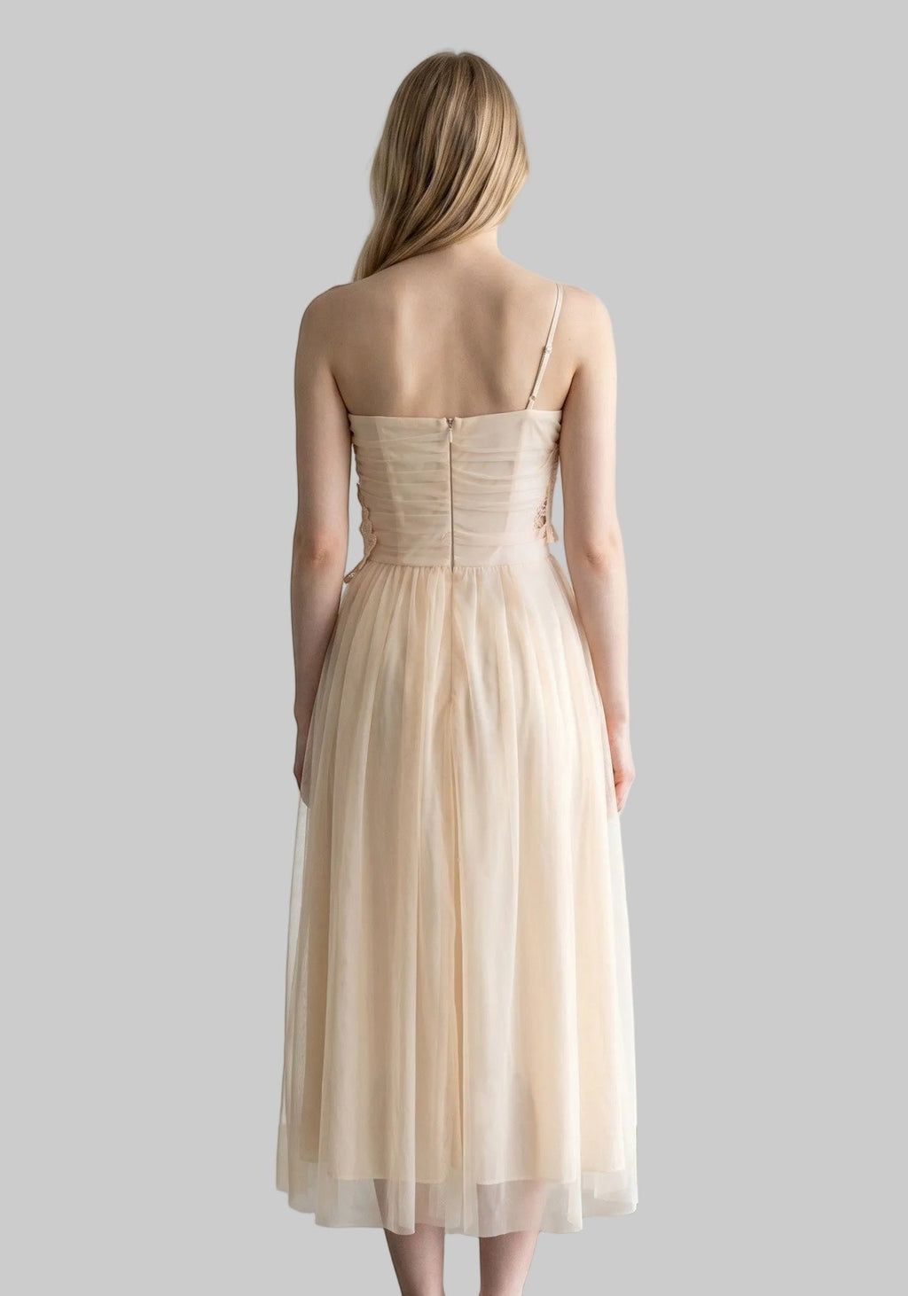 LUNRIA ivory maxi dress featuring delicate floral lace appliqué, a fitted bodice, thin straps, and a flowing layered mesh skirt.