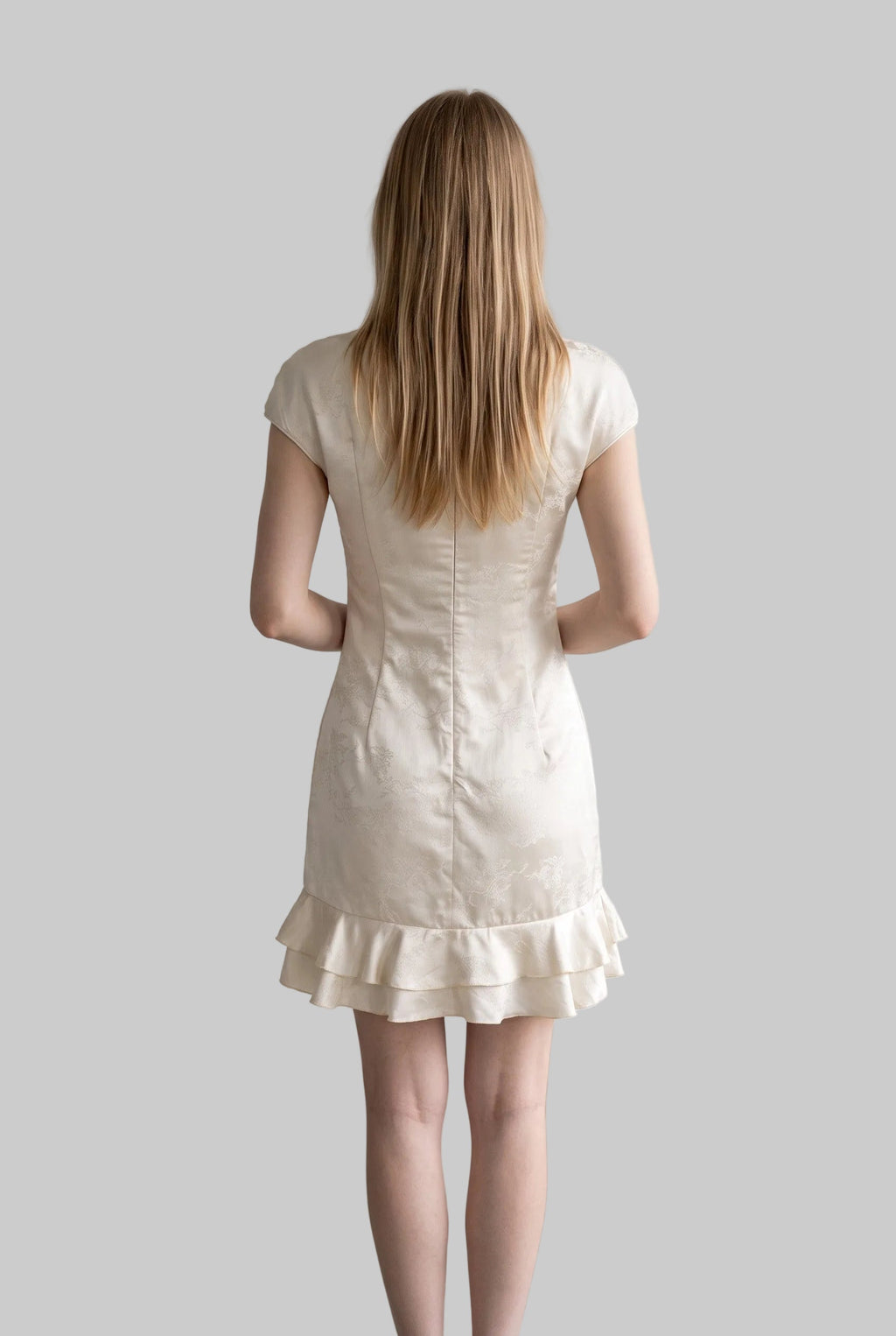 Ivory qipao mini dress with a fitted silhouette, cap sleeves and layered ruffle hem by LUNRIA.