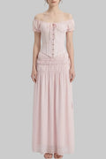 LUNRIA pink two-piece set featuring an off-shoulder lace corset top with puff sleeves and a ruched flowing maxi skirt.