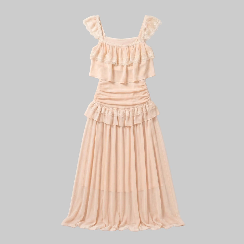 LUNRIA blush pink two-piece set featuring a ruffle crop top and matching high-waisted maxi skirt with layered ruffle details and a soft flowing silhouette.