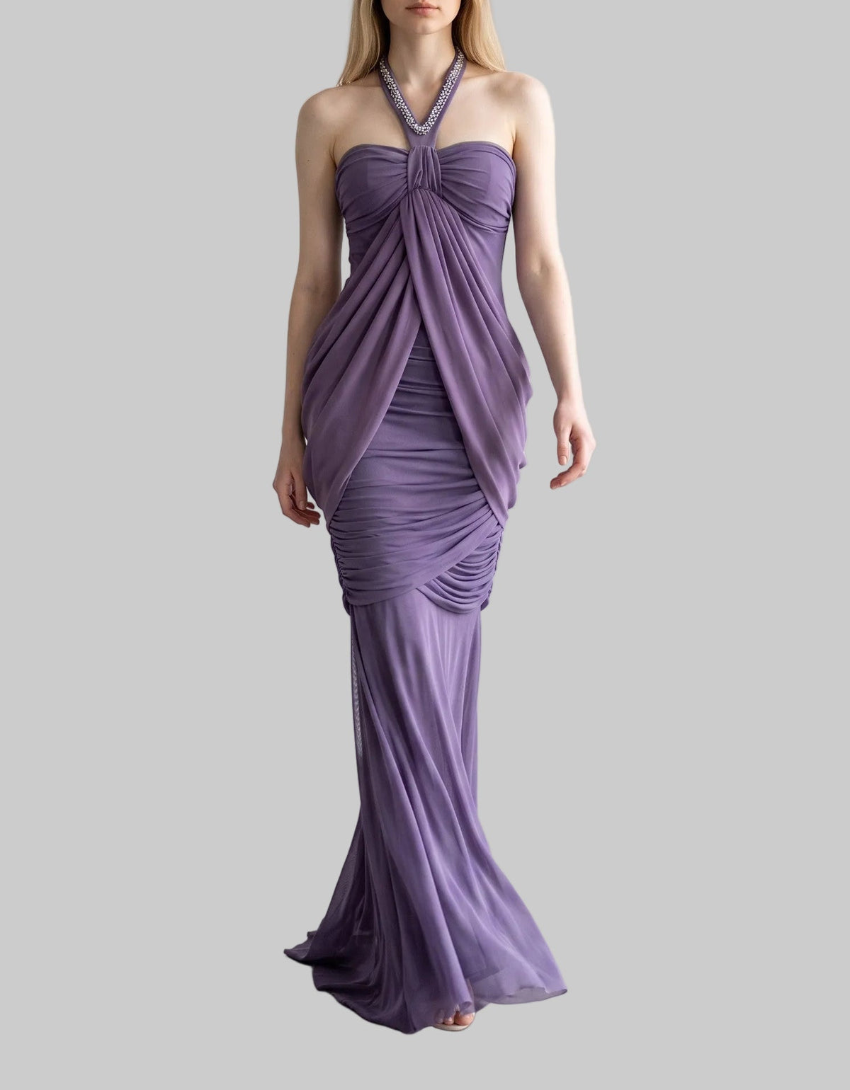 Purple ruched halter maxi dress with a fitted silhouette, draped detailing and floor-length design by LUNRIA.