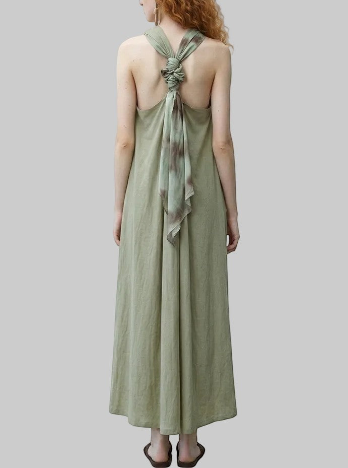 LUNRIA Sage green halter backless maxi dress with tie-dye scarf tie detail. A-line silhouette, perfect for resort wear.