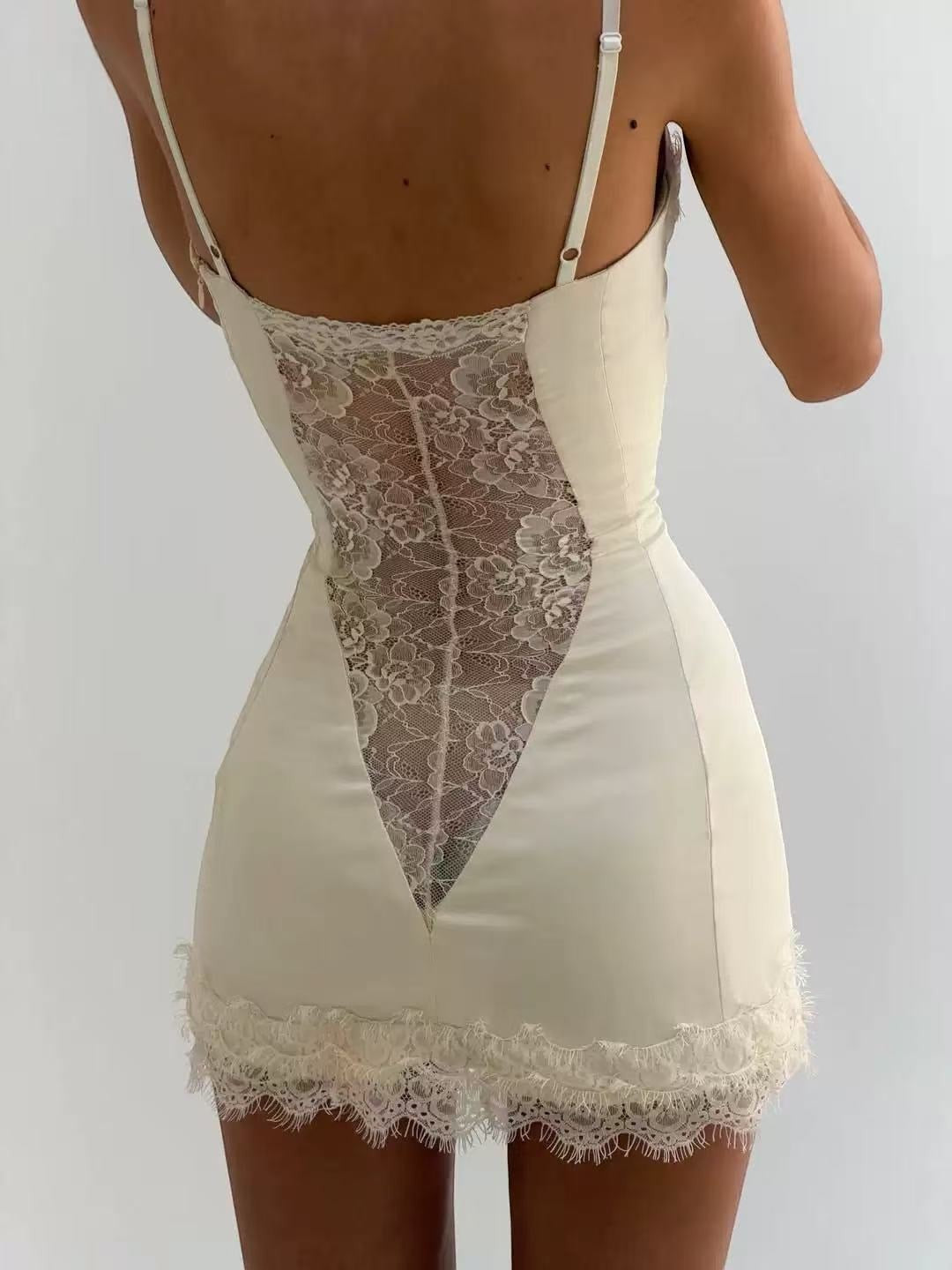 LUNRIA white lace corset mini dress featuring a structured bustier bodice, spaghetti straps, satin finish and delicate lace panel detailing.