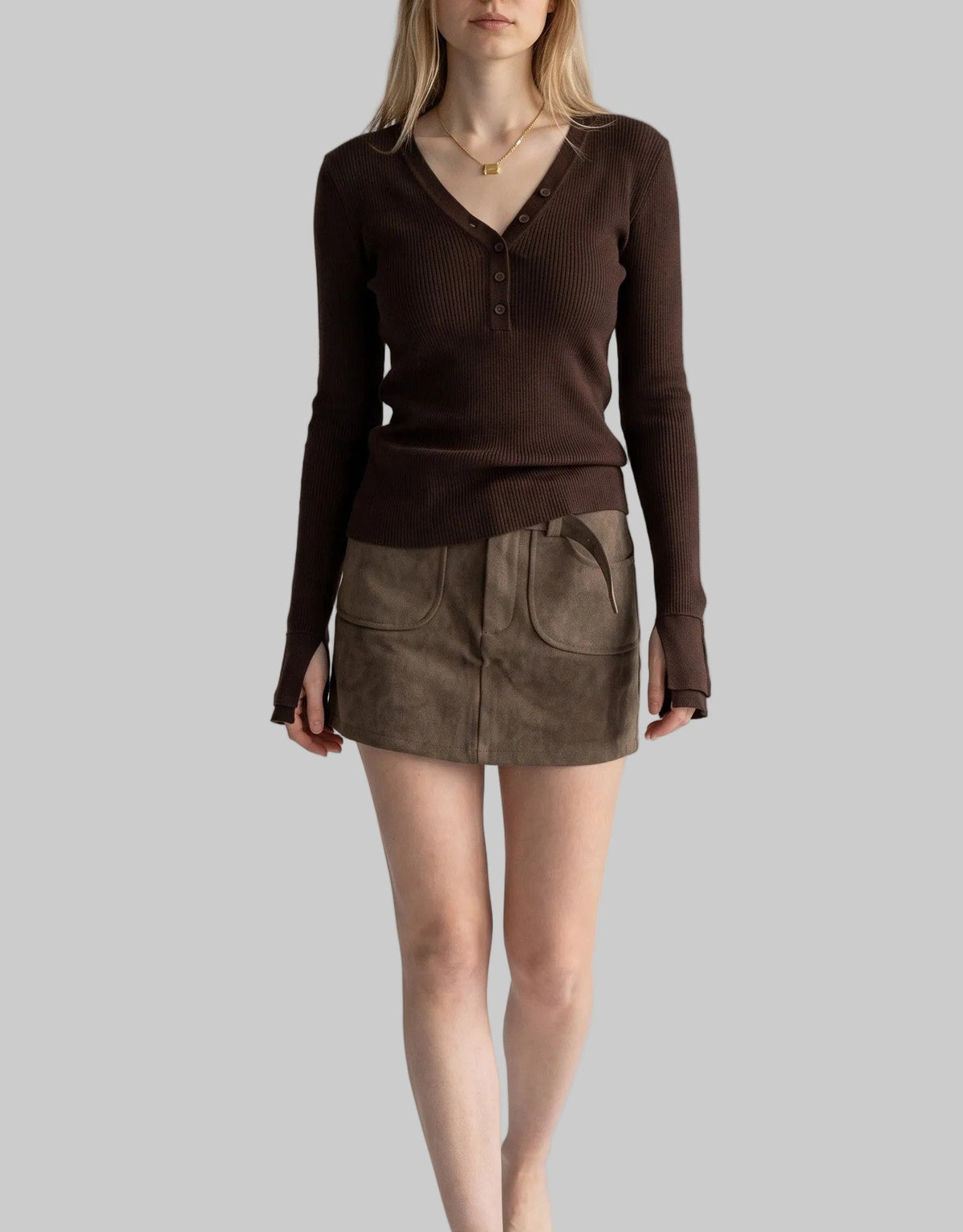 Model wearing the Sienna chocolate brown asymmetric button knit top