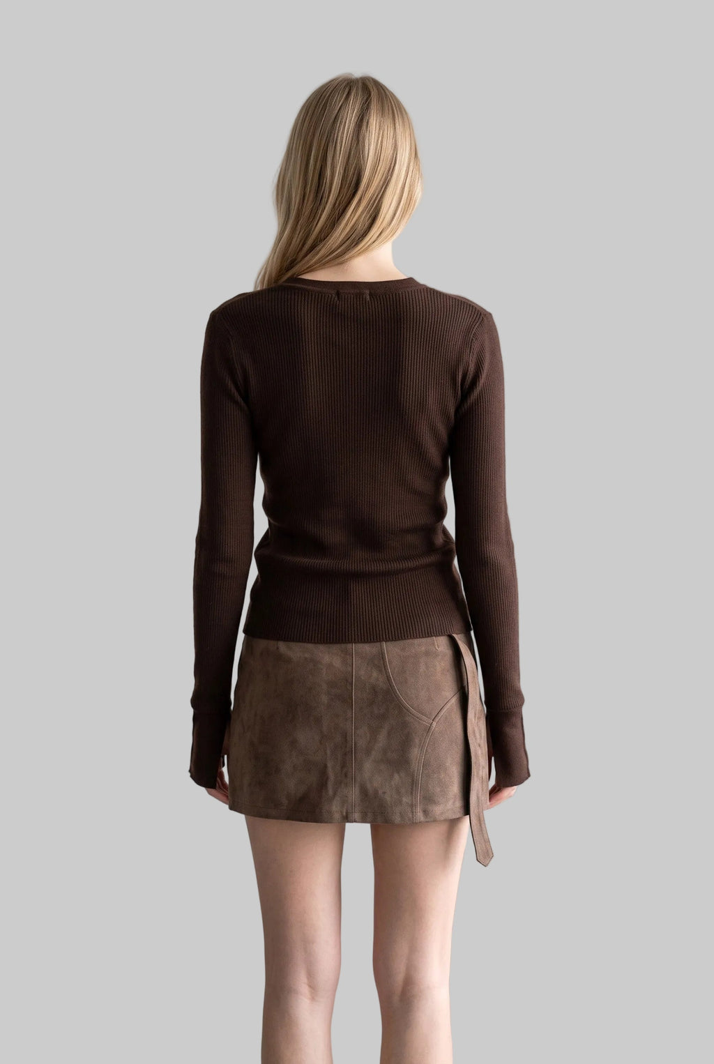 Model wearing the Sienna chocolate brown asymmetric button knit top